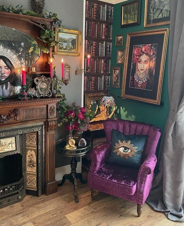 a living room filled with lots of furniture and paintings on the wall next to a fire place