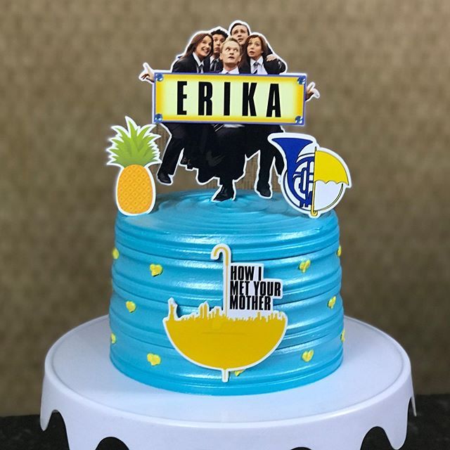 a birthday cake with an image of three people on top and the words ebika above it