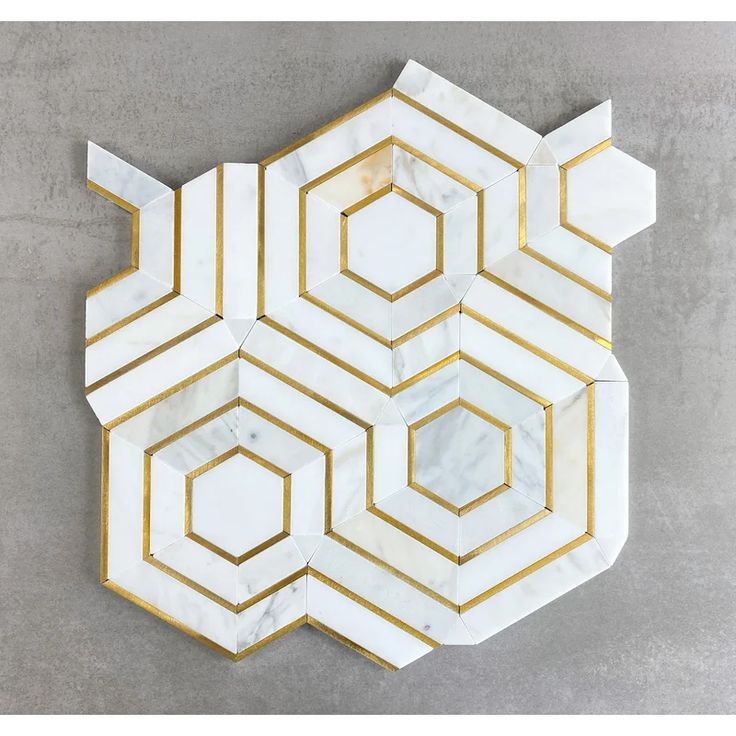 a marble and gold hexagonal wall decoration