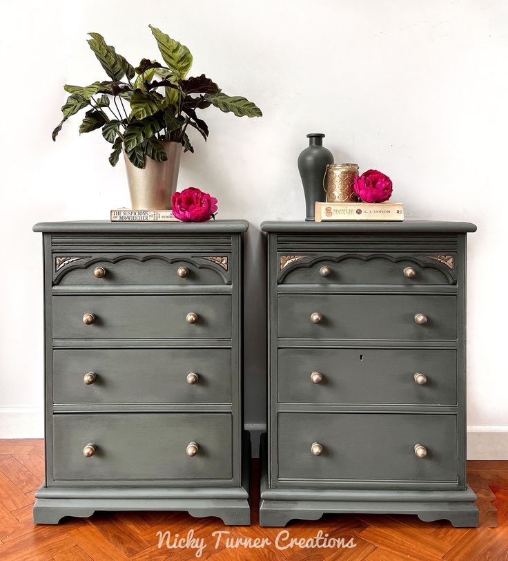 two gray dressers with pink flowers on top and gold knobs at the bottom