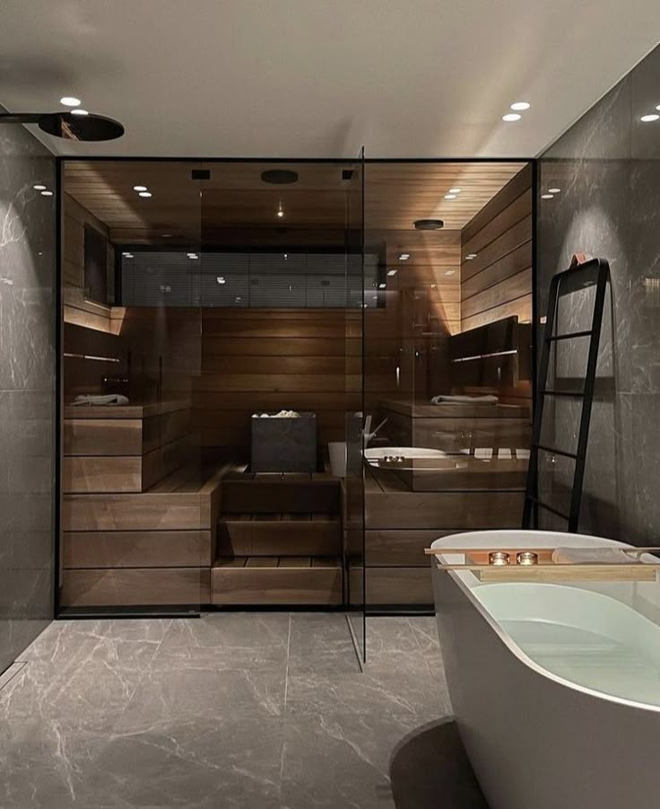 a bathroom with a large tub next to a walk - in shower and wooden walls