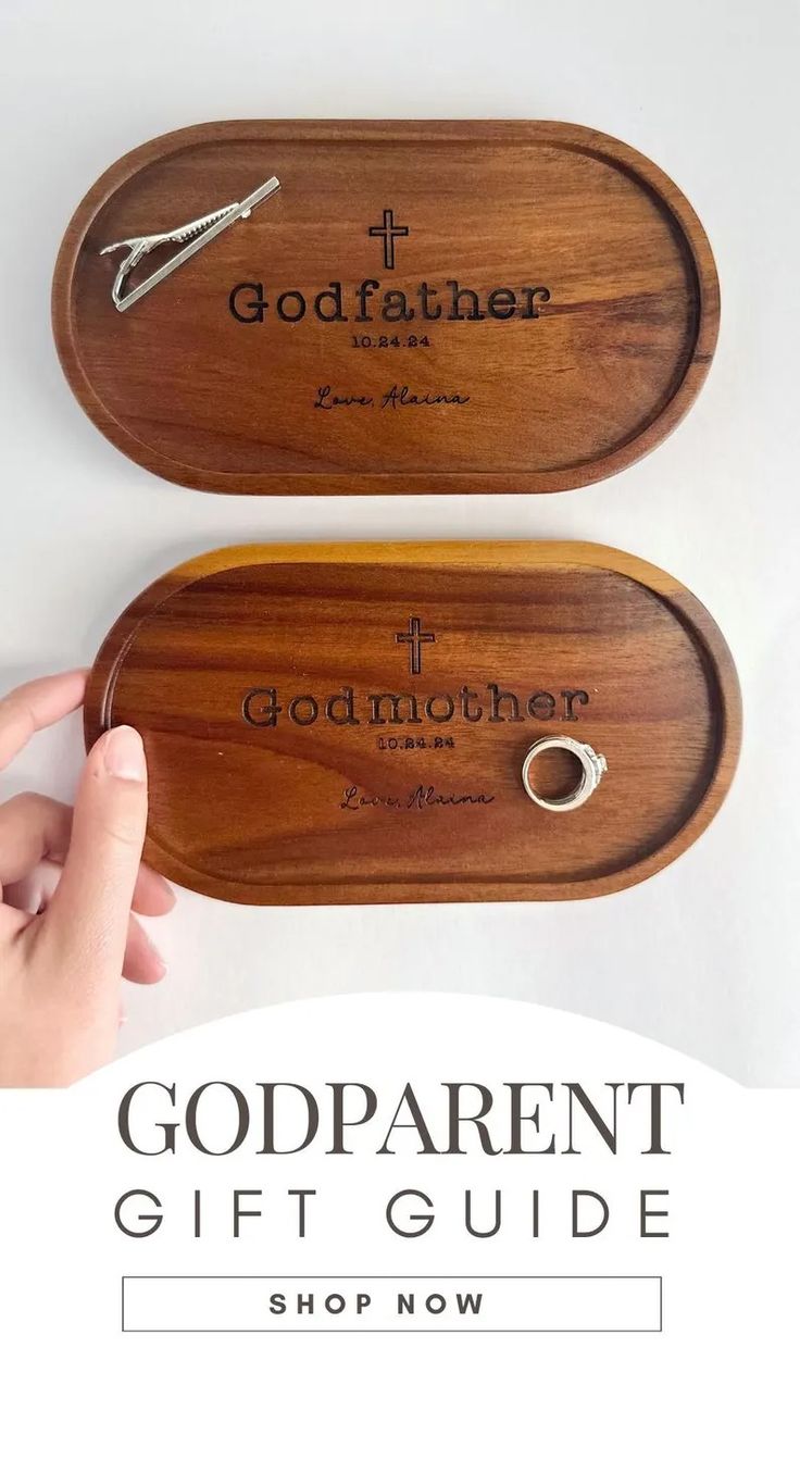 two wooden trays with the words godparent gift guide on them, and one is