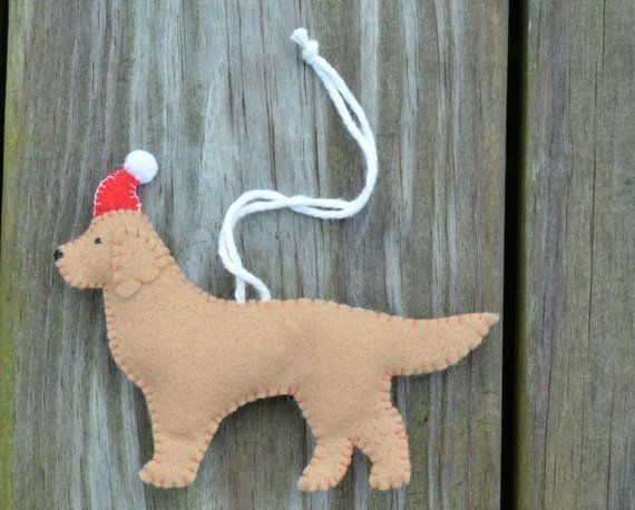 a dog ornament hanging on a wooden fence