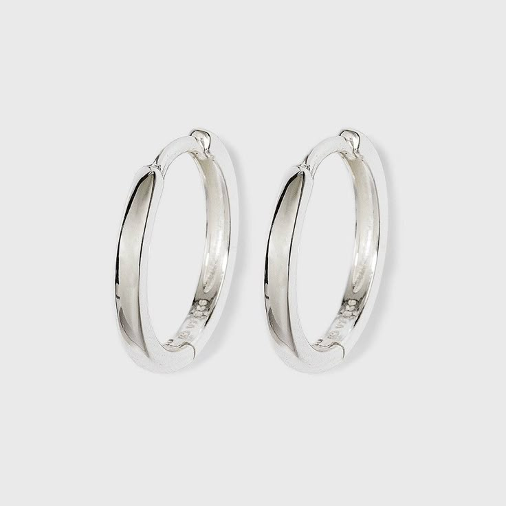 Accessorize your work or weekend look with these Silver Band Hoop Earrings from A New Day™. These sterling silver hoop earrings add shine and offer easy styling with any outfit. They feature a simple band design for minimalist style. These lightweight hoop earrings come with hinged closures for secure, easy and comfortable all-day wear, and they're made from nickel-free metal to suit most skin types. Wear them with black dresses and heels, or with everyday casual looks for effortless, chic style Cheap Small Silver Hoop Earrings, Small Tarnish Resistant Silver Hoop Earrings, Small Silver Hoop Earrings, Tarnish Resistant, Dresses And Heels, Nickel-free Small Hoop Sterling Silver Earrings, Small Hoop Nickel-free Sterling Silver Earrings, Simple Band, Band Design, Casual Accessories