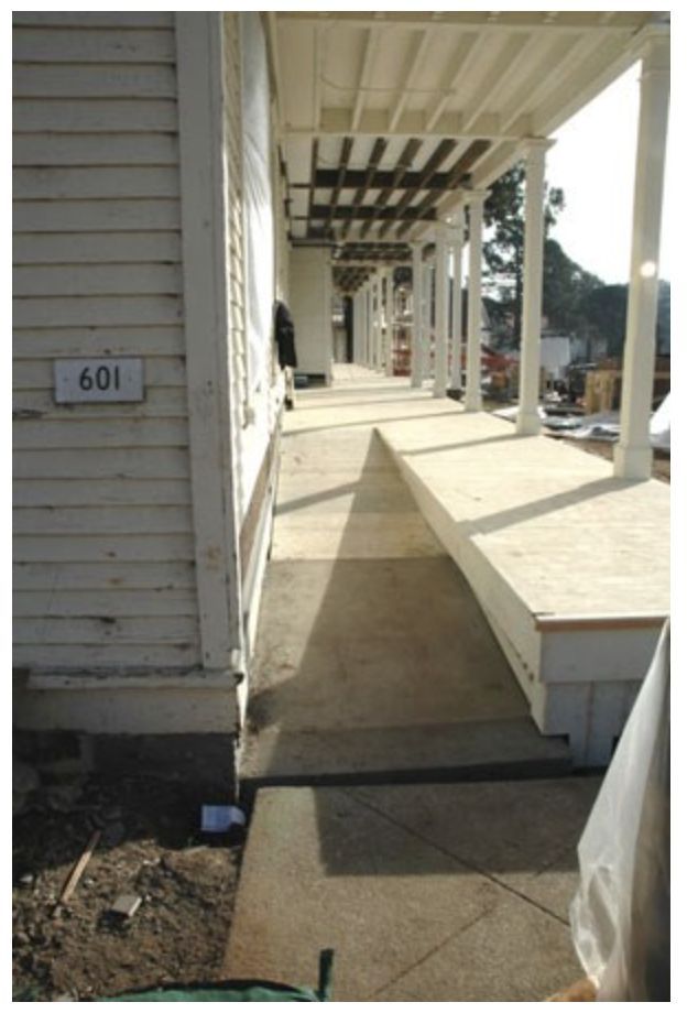 the front porch is covered with plastic bags