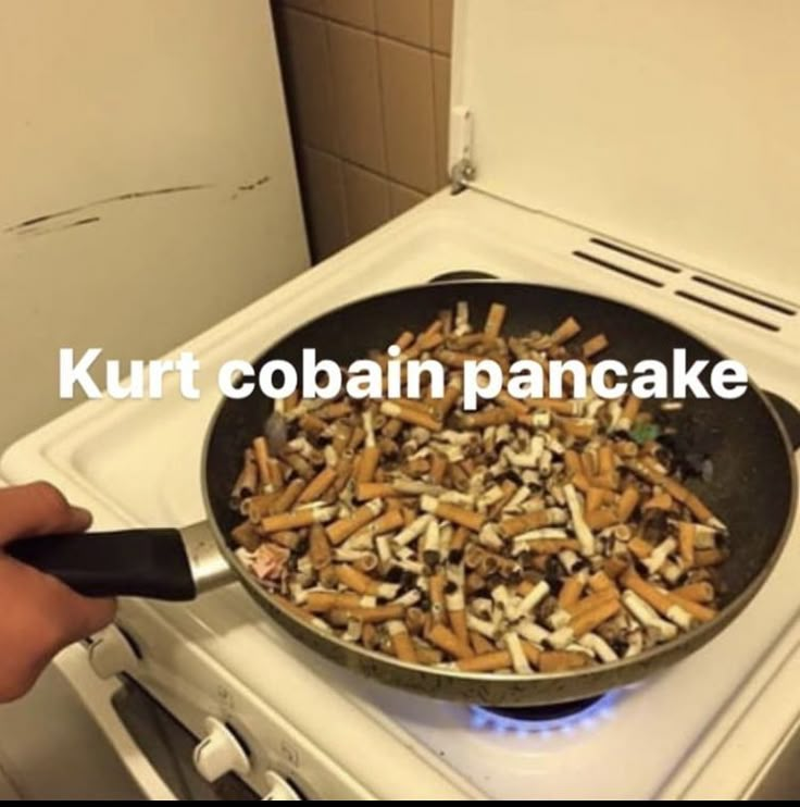 a pan filled with food sitting on top of a stove next to a burner