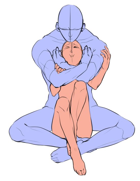 a person sitting on the ground with their arms wrapped around another person's head