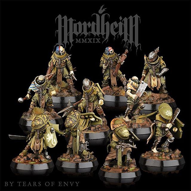 the warhammers are painted in gold and silver, with black lettering on them