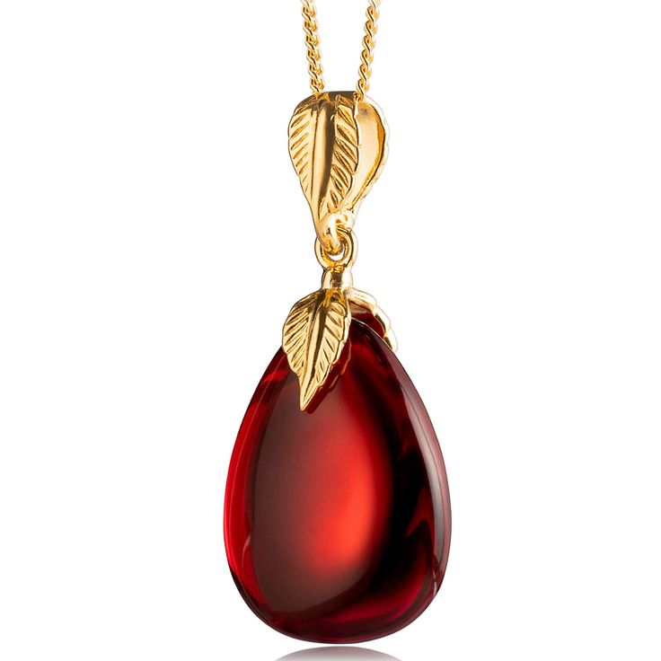 Introducing our stunning Red Amber Pendant - a true testament to the beauty and elegance of natural amber. Handcrafted with care and precision, this pendant is made of precious red amber, making it a unique and eye-catching addition to your jewelry collection. Featuring a beautiful drop/oval shape, this pendant is adorned with a gold-plated sterling silver ag925 leaf ornament fitting, ensuring both comfort and safety in use. This amber pendant is sure to turn heads with its dark red color and stunning design, making them a perfect accessory for any occasion. The pendant measures 0.78x1.65in size, making it the perfect statement piece to add to any outfit. Its impressive weight of approximately 4g is a testament to the high-quality materials used in its construction. Crafted from genuine re Blue Amber, Garnet Red, Carnelian Pendant, Golden Necklace, Amber Pendant, Vintage Monet, Ashtanga Yoga, Ball Necklace, Yoga Jewelry