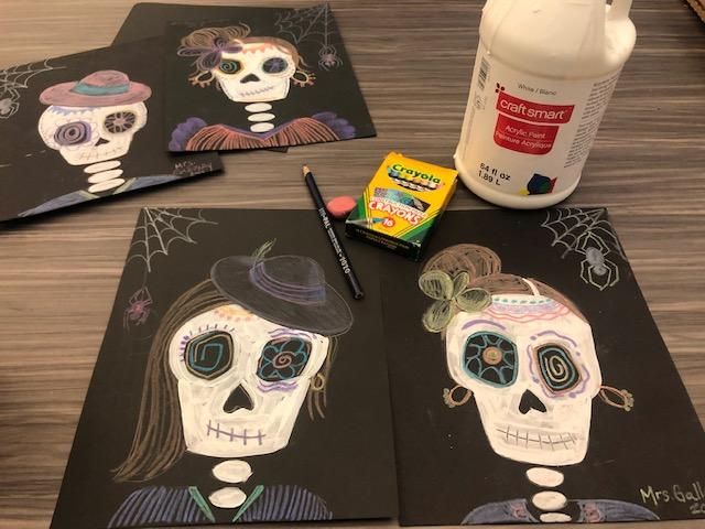 three halloween cards with skulls painted on them