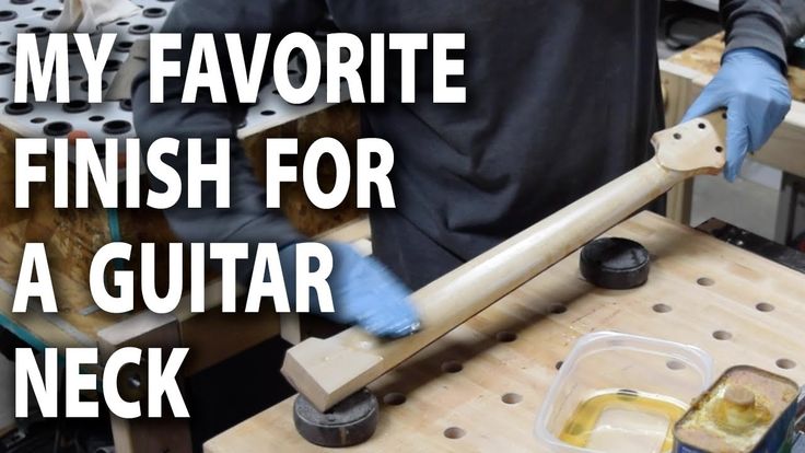 a man in blue gloves working on a piece of wood with the words, my favorite finish for a guitar neck