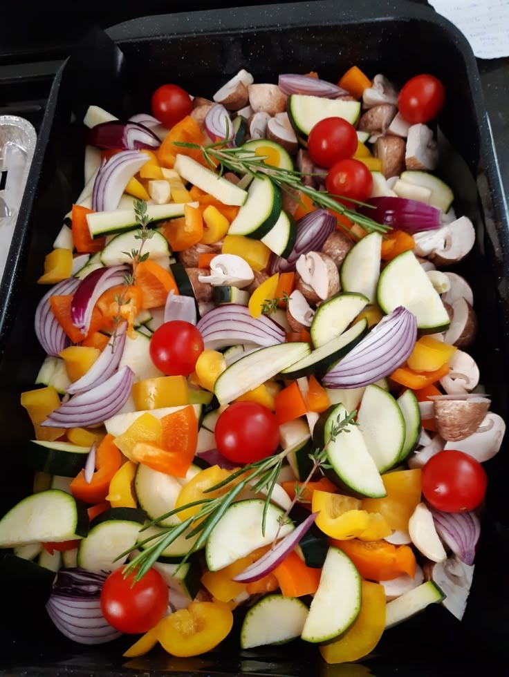 a pan filled with lots of different types of vegetables