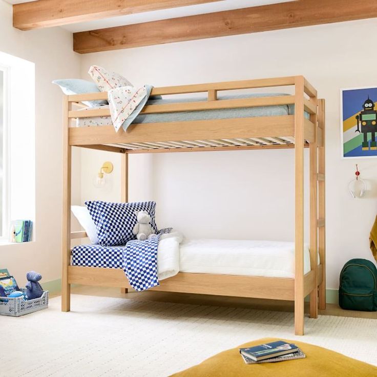 a child's bedroom with bunk beds and toys