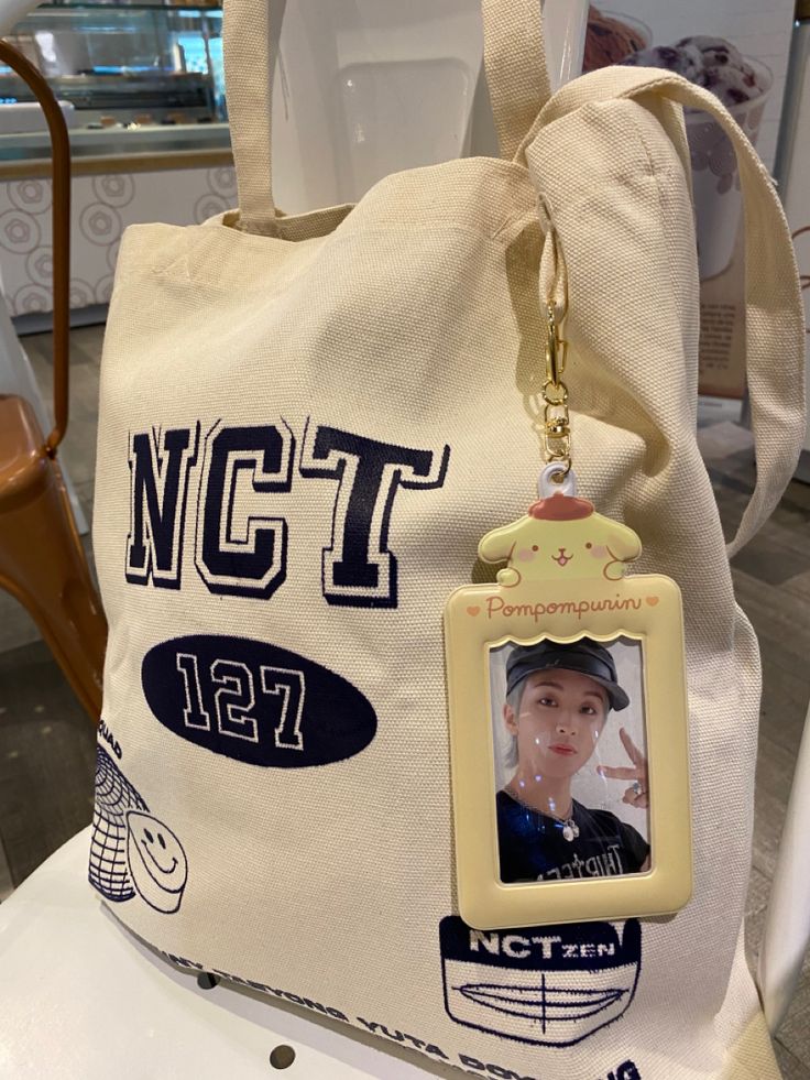 a white bag with an image of a woman's face on the front and back