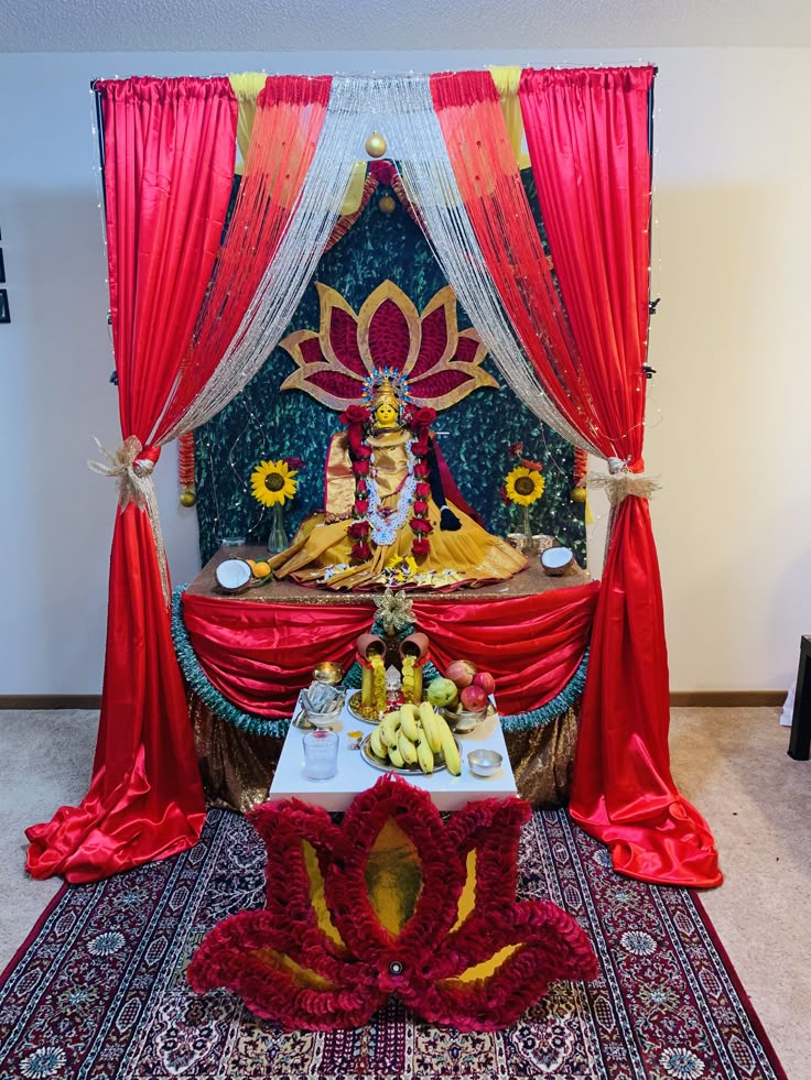 the altar is decorated with red drapes and sunflowers on it's side