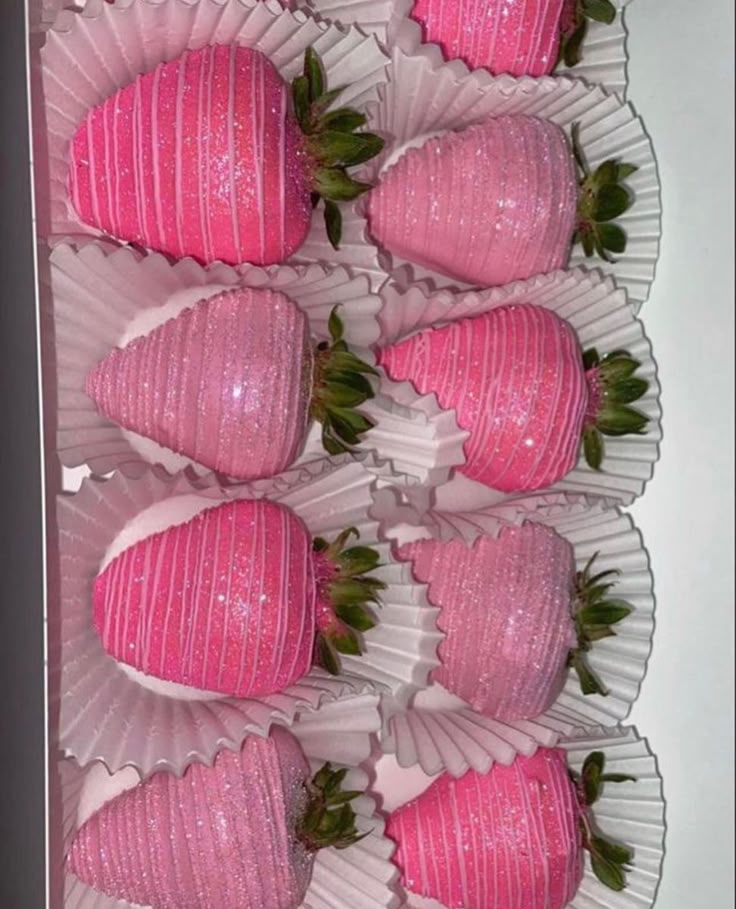 pink strawberries are arranged in the shape of hearts