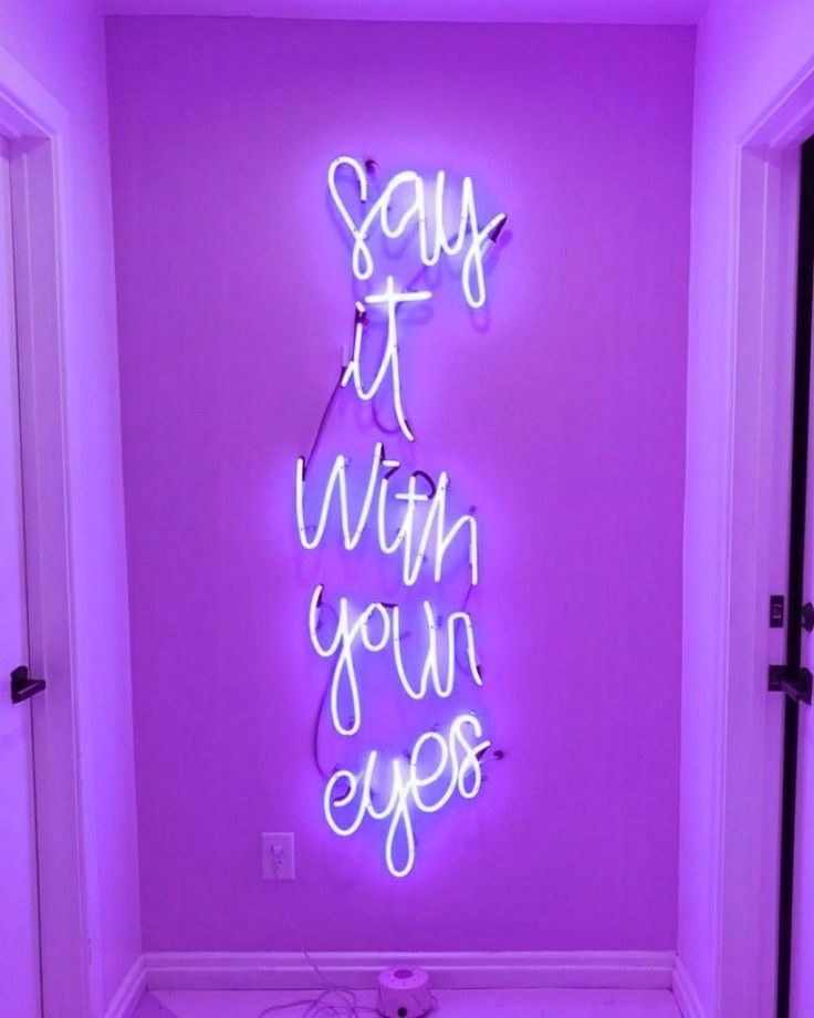 a neon sign that says, say it when you're eyes on the wall