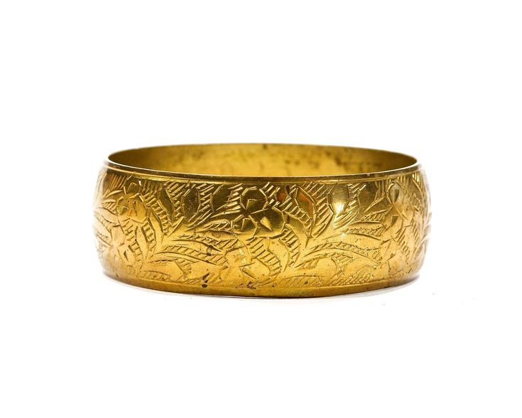 "One simply adorable solid brass bangle with a beautiful intricate edged floral design. Grate vintage condition, a touch of tarnish adds great character. Inside diameter is 2.75\", and 1\" wide. NOTE: The beauty of all ethnic jewelry comes to form its distinct rustic feel. There are unique variations in color and texture due to the handmade process." Puka Shell Necklace, Nature Necklace, Brass Bangle, Puka Shell, Bracelet Cuff, Hat Band, Ethnic Jewelry, Rustic Feel, Shell Necklaces