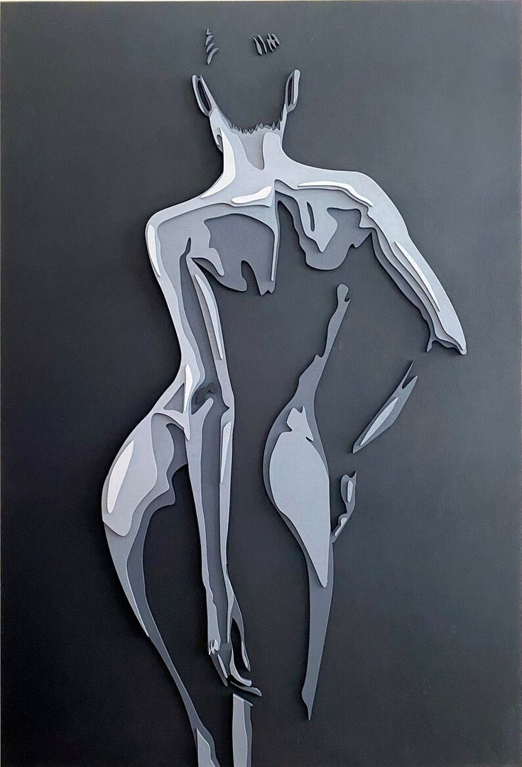 a metal cut out of a woman's body