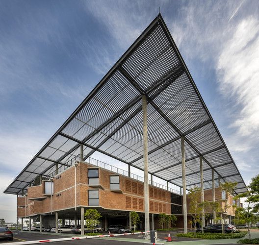 a large building that has a metal roof over it