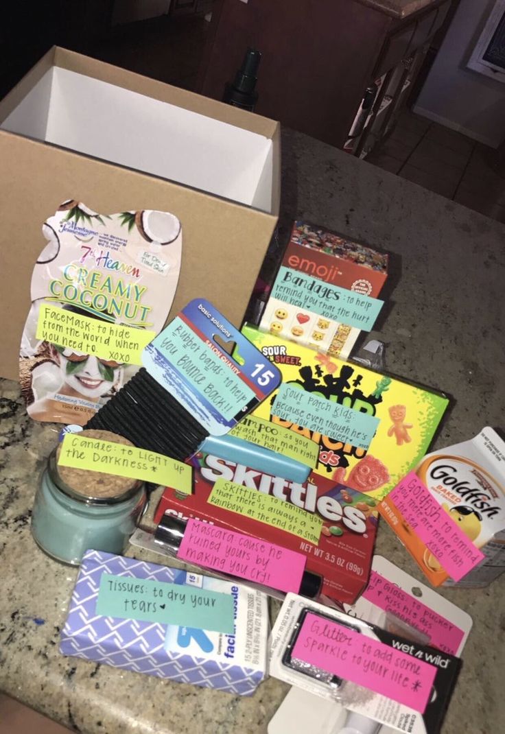 many different items are on the counter in front of a box with some writing on it