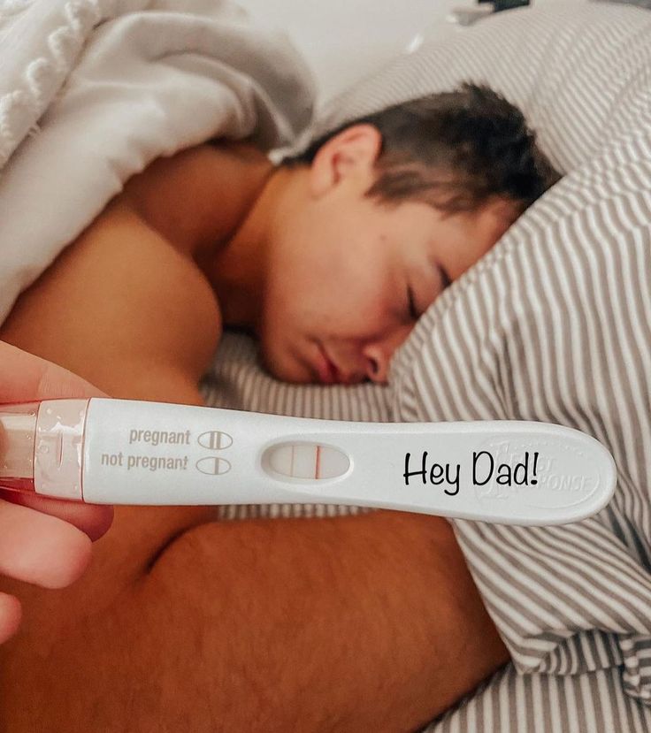 a man sleeping in bed with a thermometer attached to his arm that says hey dad