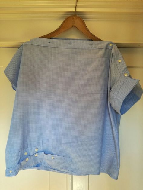 a blue shirt hanging on a wooden hanger