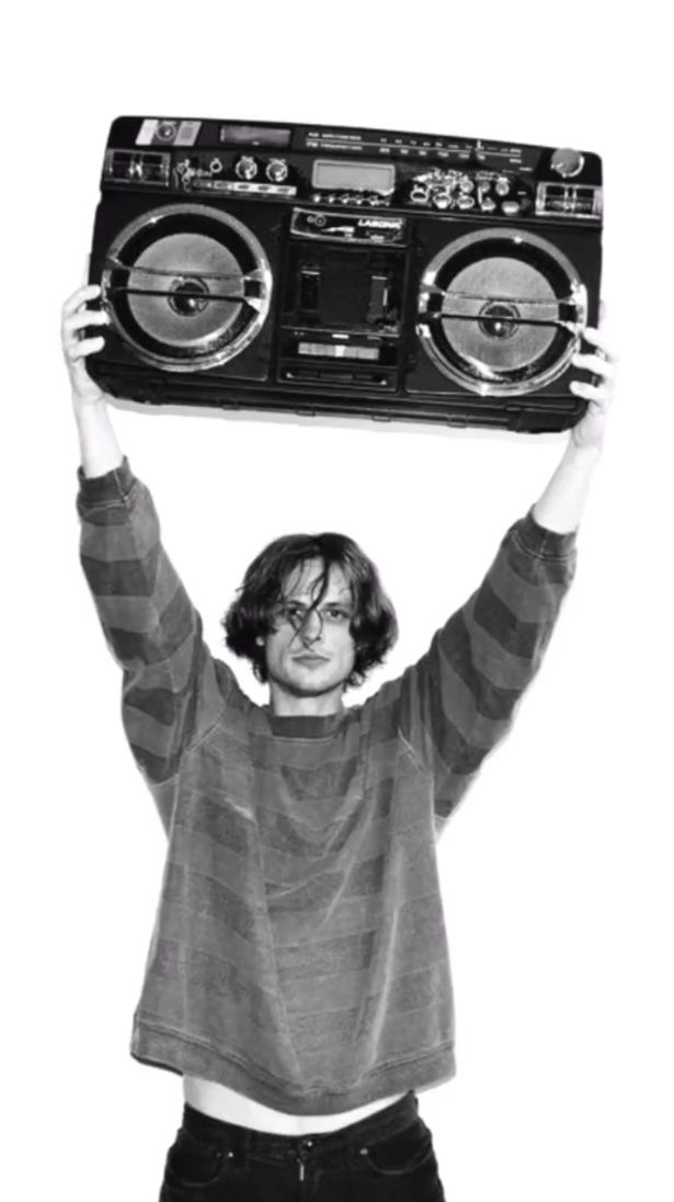 a woman holding up a boombox over her head