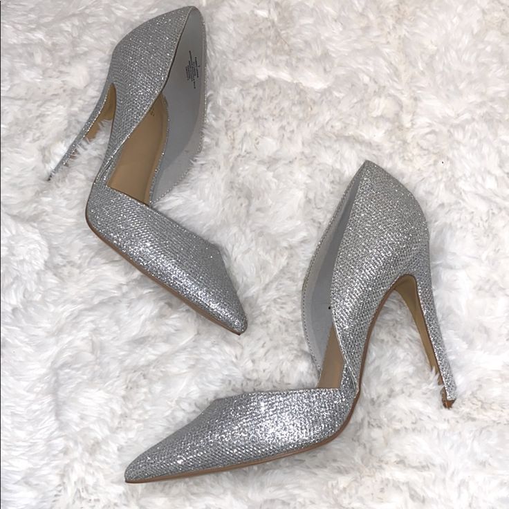 Excellent Condition, Never Worn. Silver Sparkle Sequins In Size 7. Fits Like 7.5. Chic Metallic Silver Pointed Toe Heels, Elegant Pointed Toe Heels With Silver Studs, Glamorous Metallic Pointed Toe Heels, Glamorous Metallic Heels With Pointed Toe, Chic Silver Heels For Prom, Metallic Silver Pointed Toe Heels With 4-inch Heel, Metallic Silver Heels With Pointed Toe And 4-inch Heel, Chic Silver Heels With Round Toe, Chic Metallic Silver Heels For Night Out