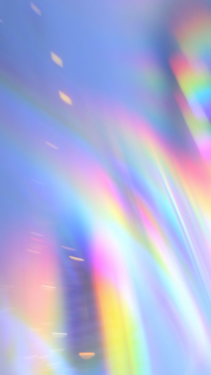 a blurry image of the sky and clouds with rainbows in it's foreground