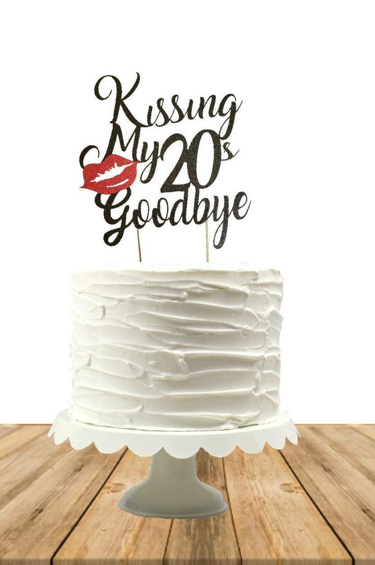 a white cake with a red lipstick on top and the words kissing my 20 goodbye