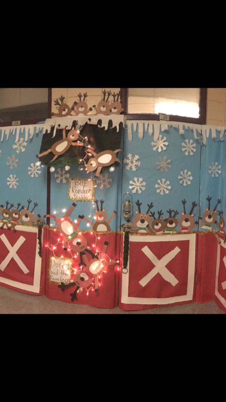 a decorated wall with christmas decorations and lights in the center, along with snowflakes