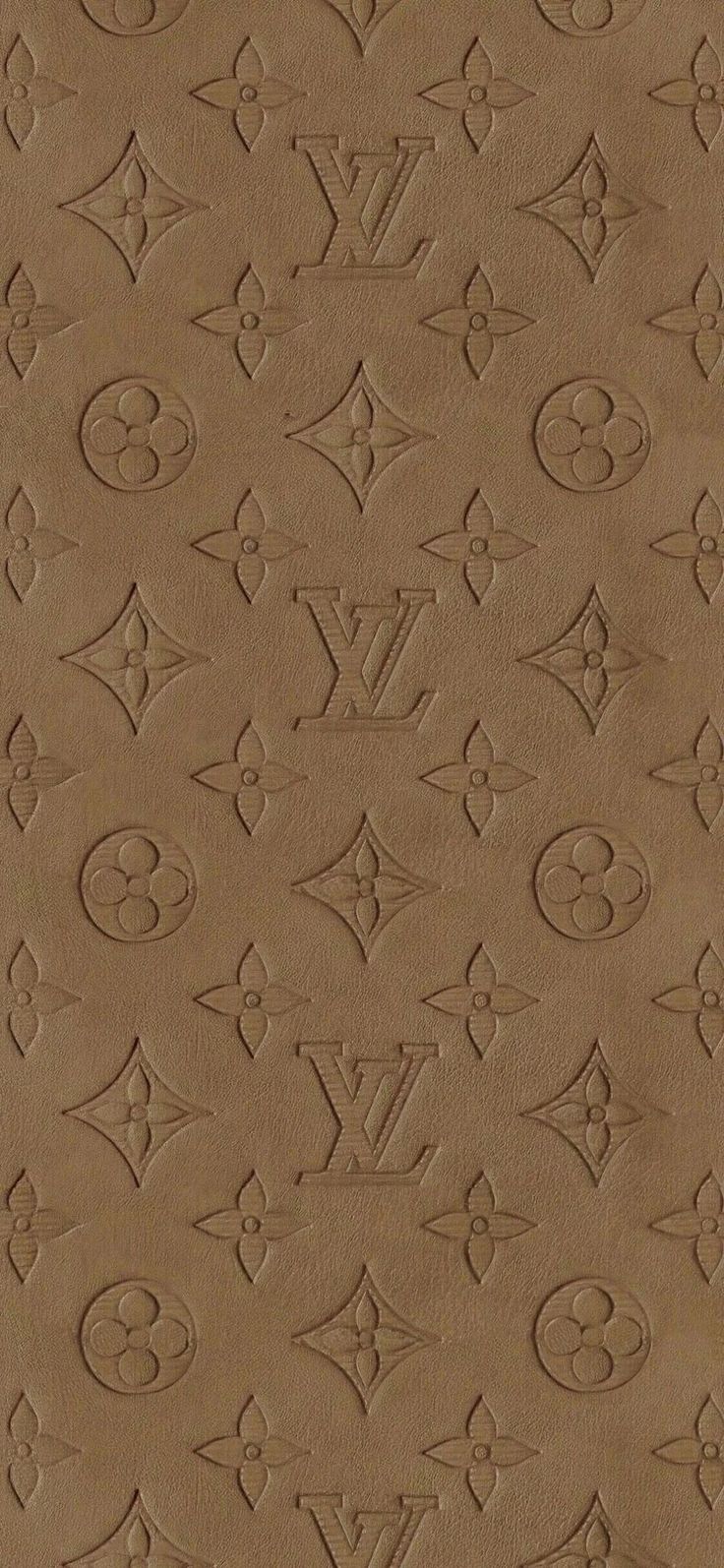 an image of a brown wallpaper with many different symbols on it and the words louis vuitton written in cursive writing