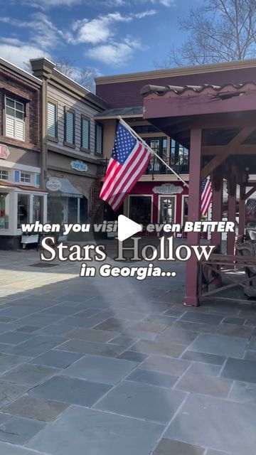 an american flag flying in front of a building with the words, when you wish to be better stars hollow in georgia