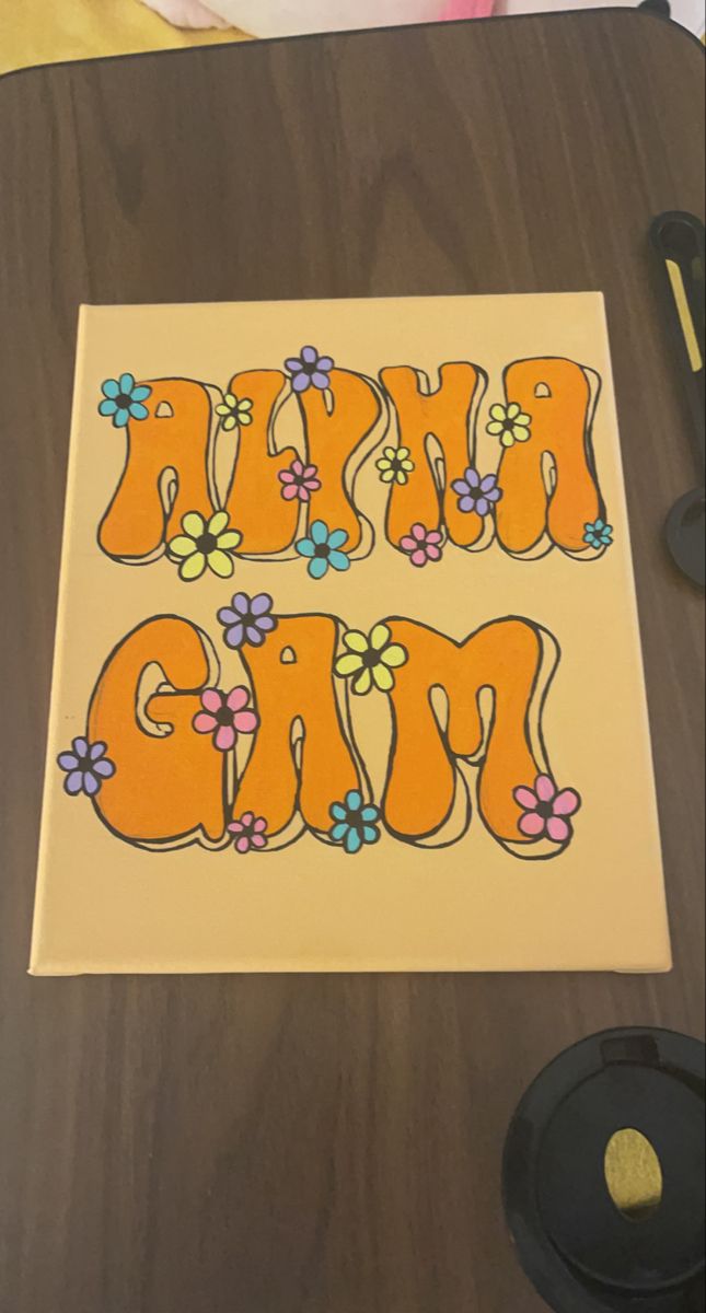 an orange and blue sticker that says happy mom with flowers in the letters on it