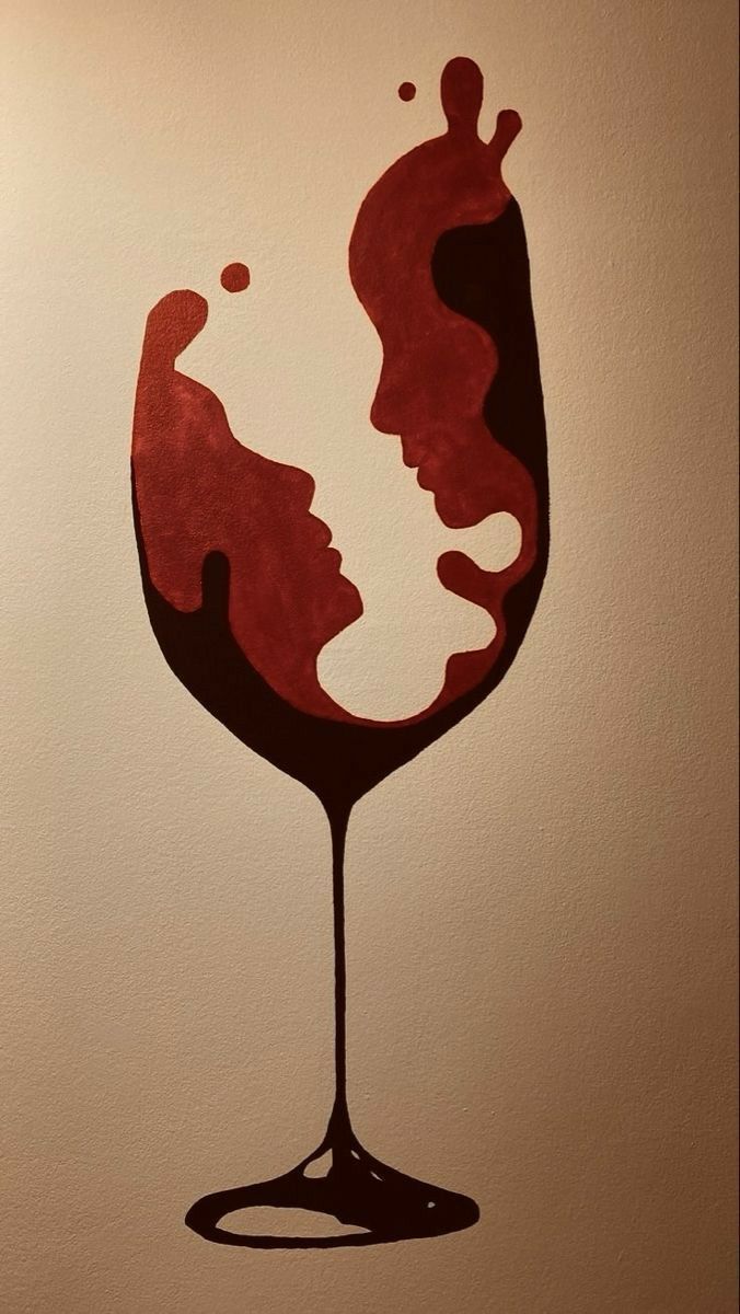 a drawing of a woman's face in a glass of red wine on the wall