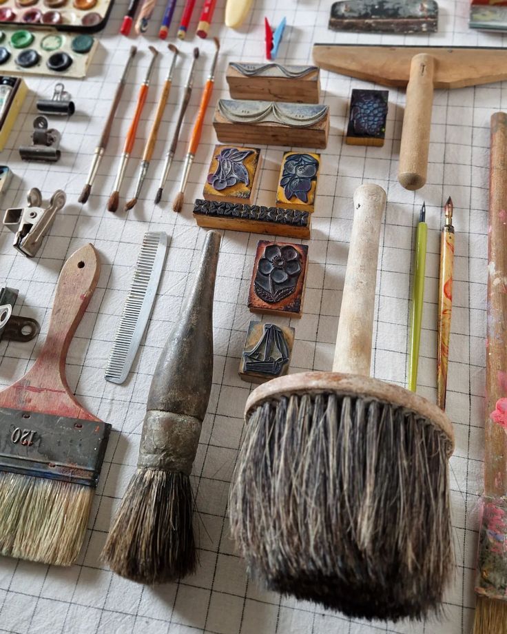 many different types of art supplies on a table