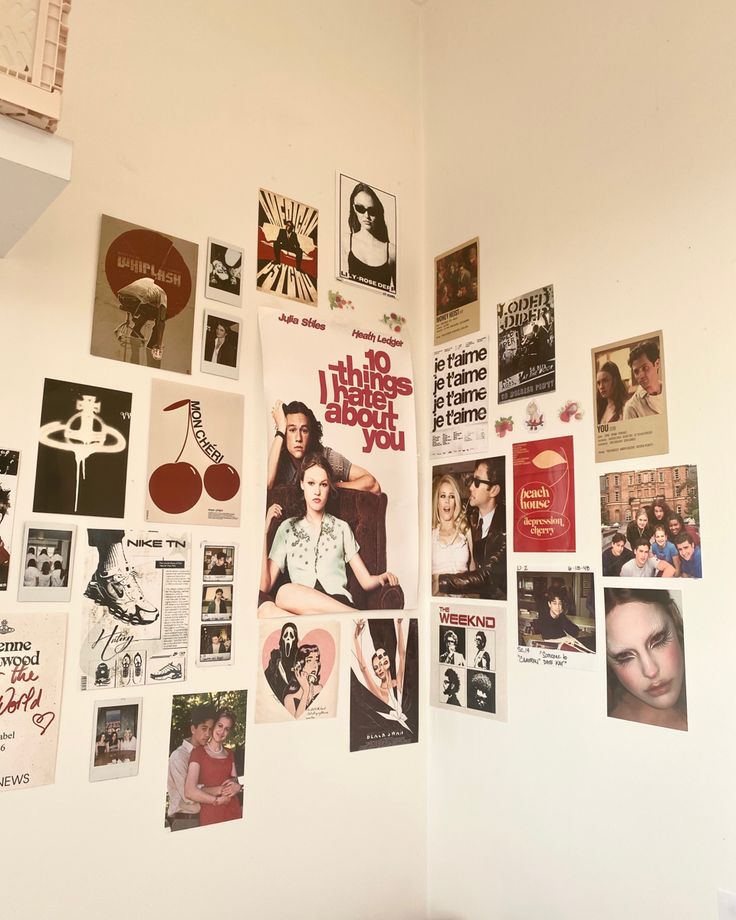 the wall is covered with posters and pictures from various films, including one that has been written on it