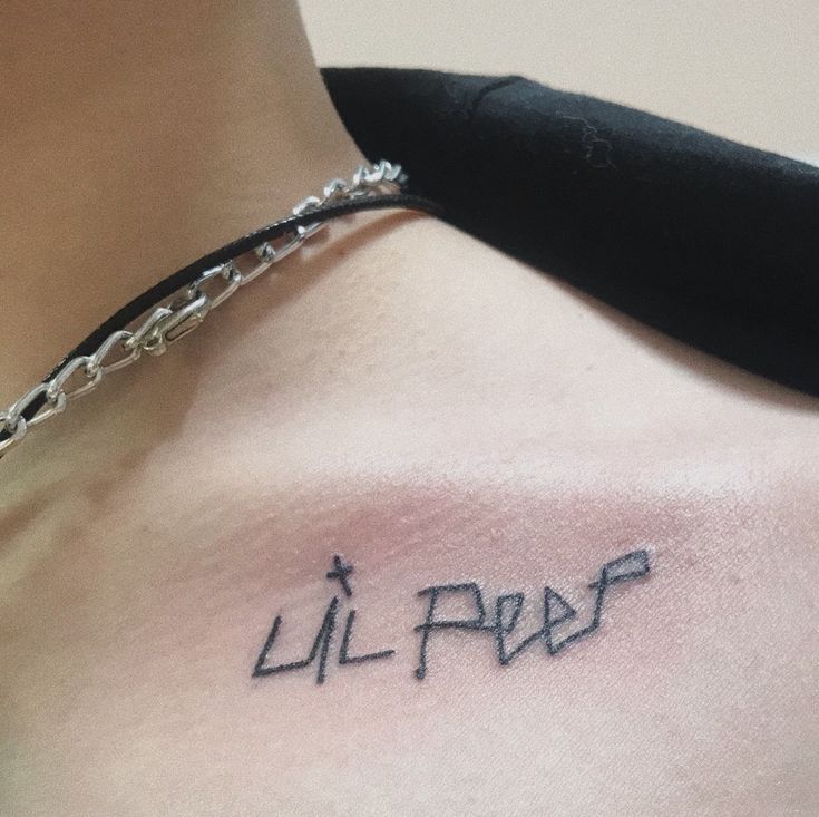 a man's chest with the word lil pop written on it in cursive font