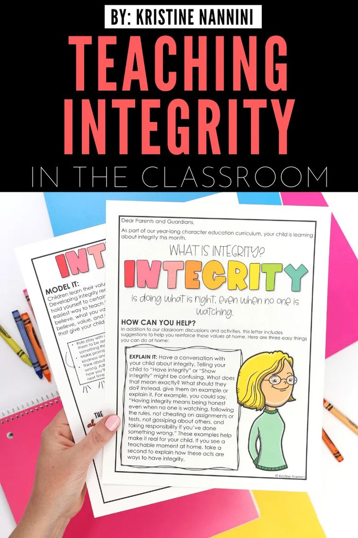 a person holding up a book with the title teaching integity in the classroom