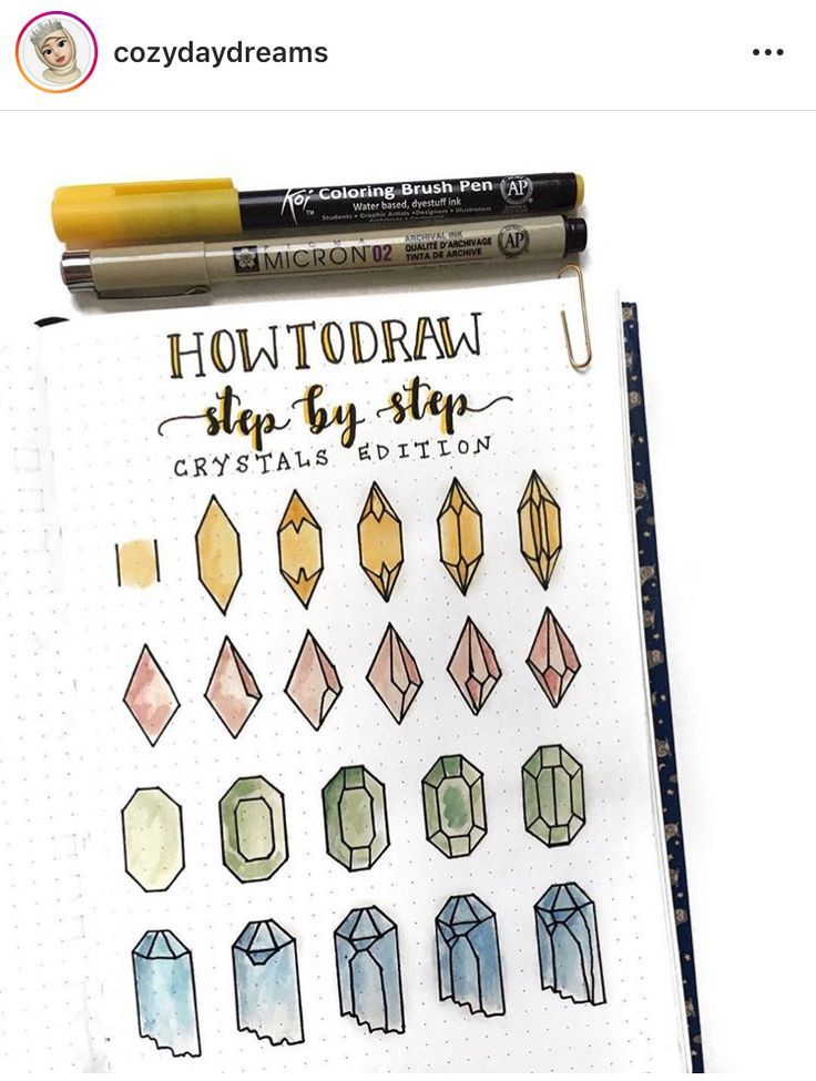 an open notebook with some drawings on it and a marker next to it that says how to draw step by step crystals