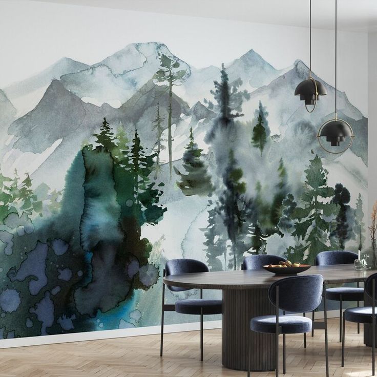 a dining room table with chairs and a wall mural in the background that has trees on it