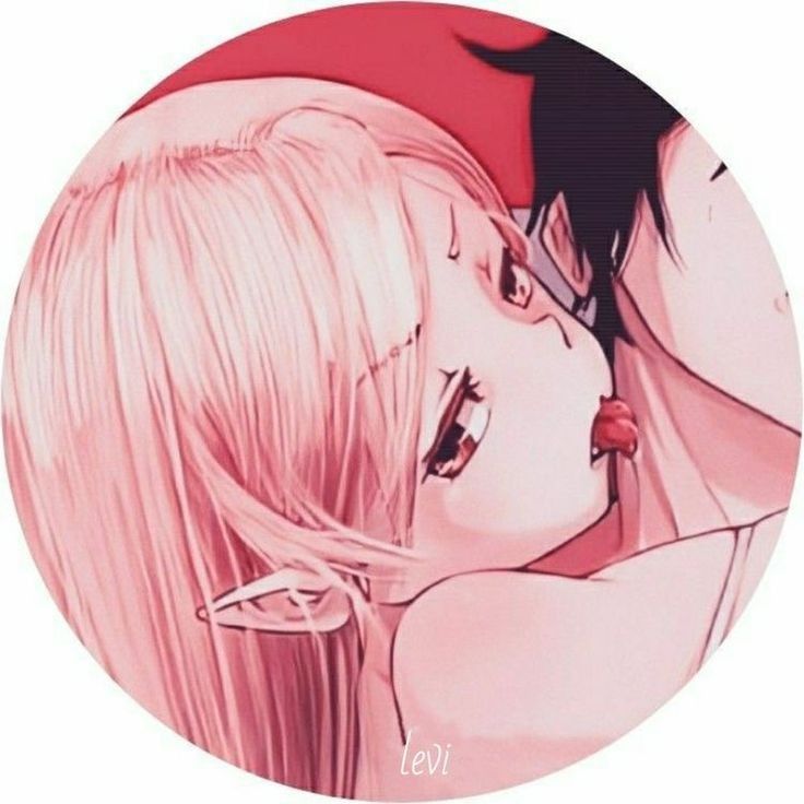 two anime characters kissing each other in front of a red circle with the word love written on it