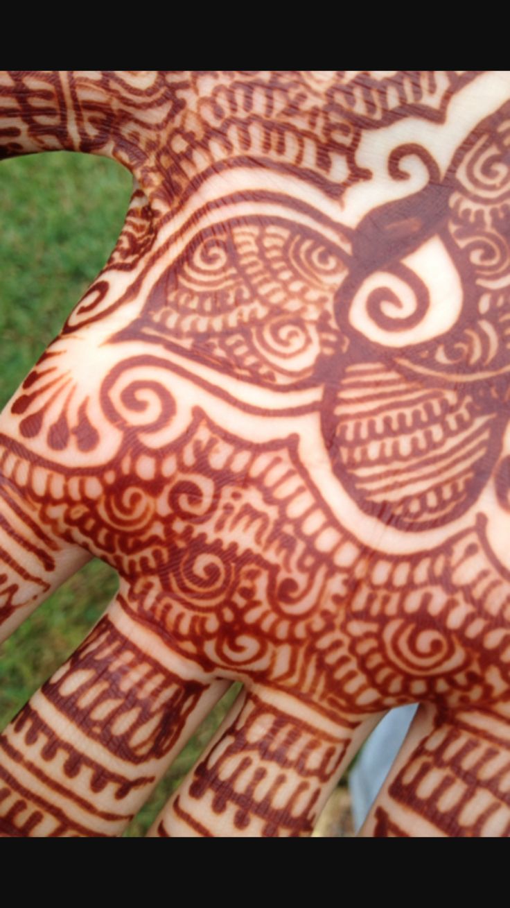 the hand is decorated with intricate designs