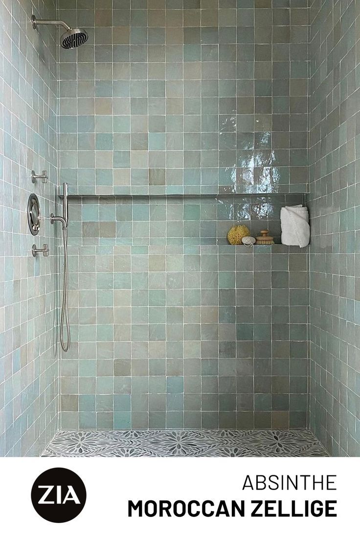 a bath room with a walk in shower next to a toilet