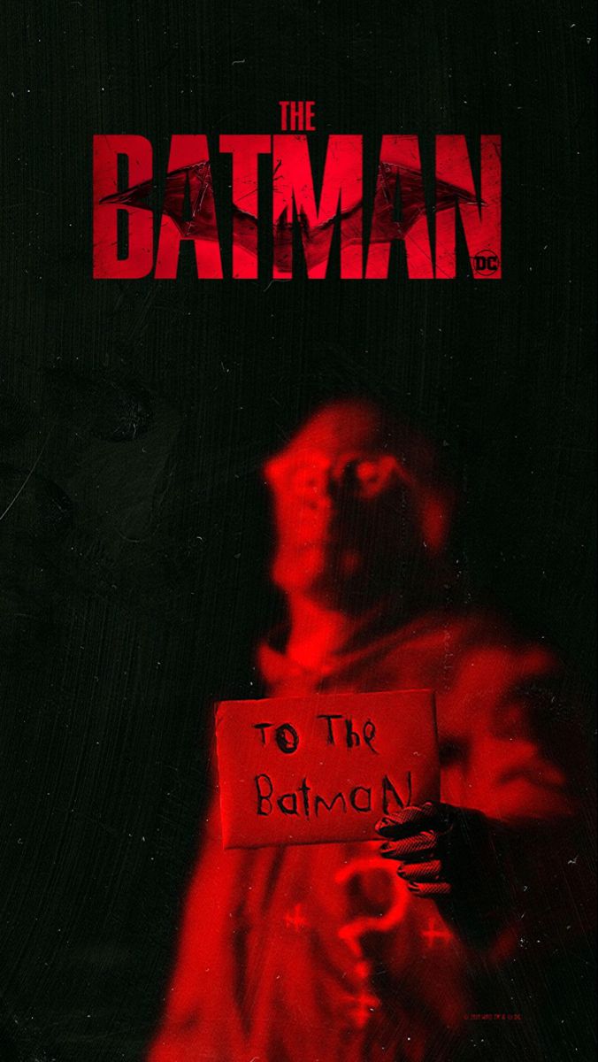 the batman movie poster with a man holding a sign that says, to the batman