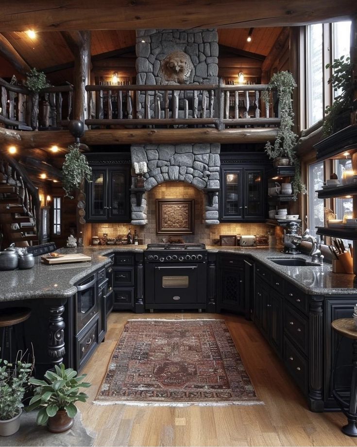 a large kitchen with black cabinets and wooden floors is pictured in this image from the inside