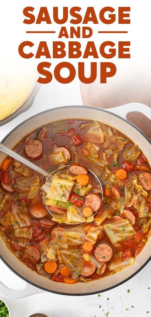 sausage and cabbage soup in a pot with spoon