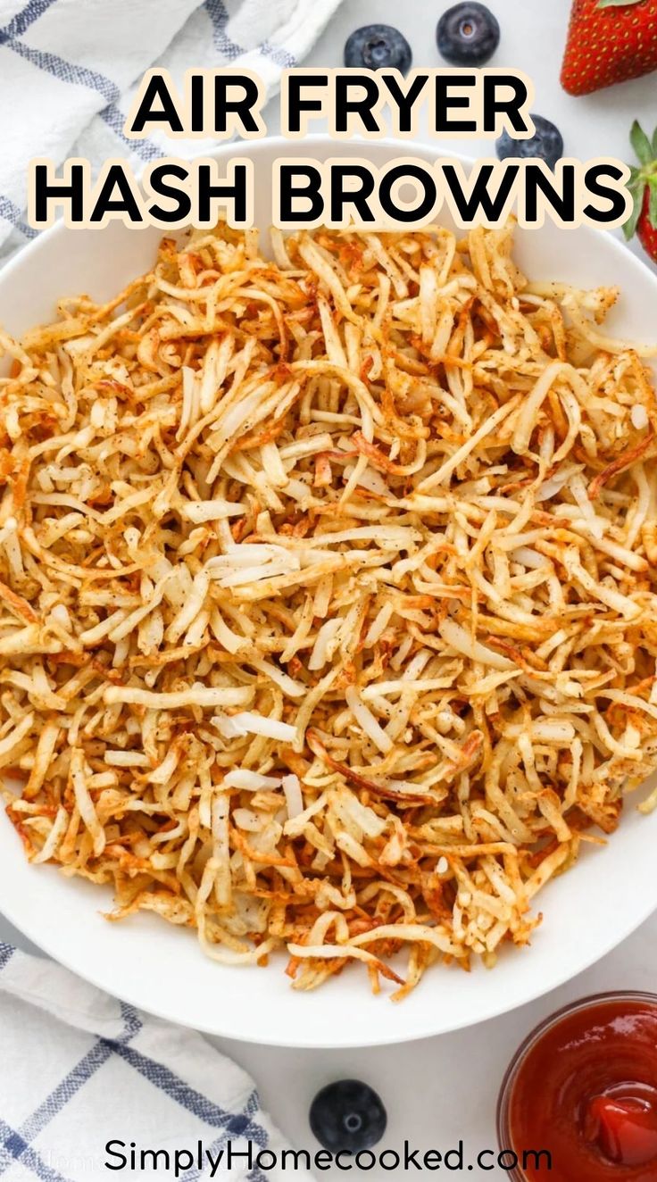 a white bowl filled with fried hash browns on top of a blue and white checkered table cloth