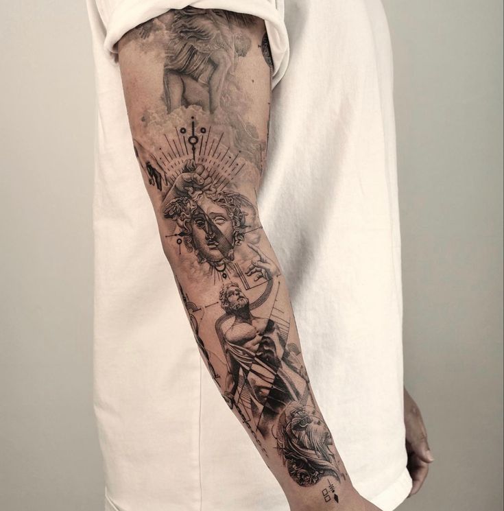 a man's arm with tattoos on it and an angel above the other arm